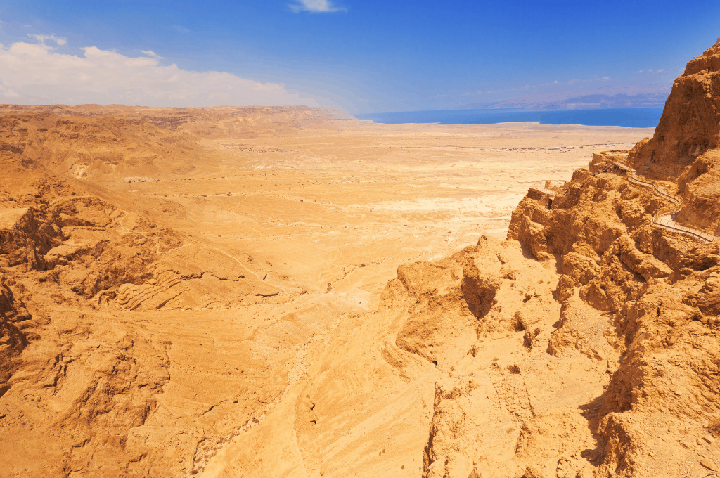 wilderness desert with sea in the distance to the top right