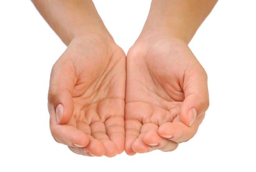 Cupped hands of young woman - isolated on white background