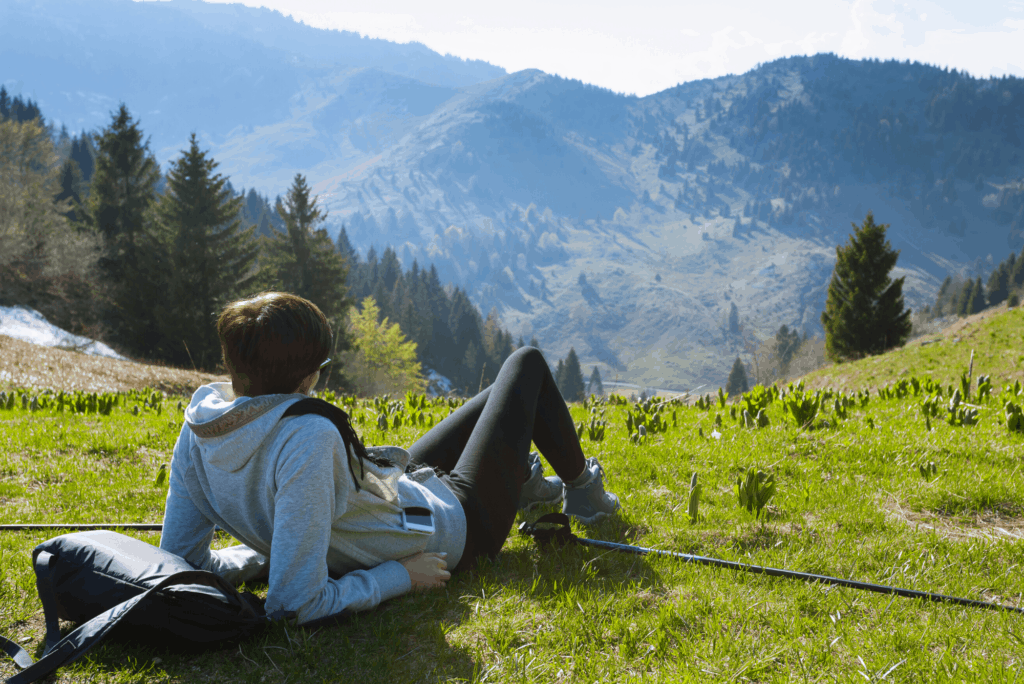 woman looking at higher mountain